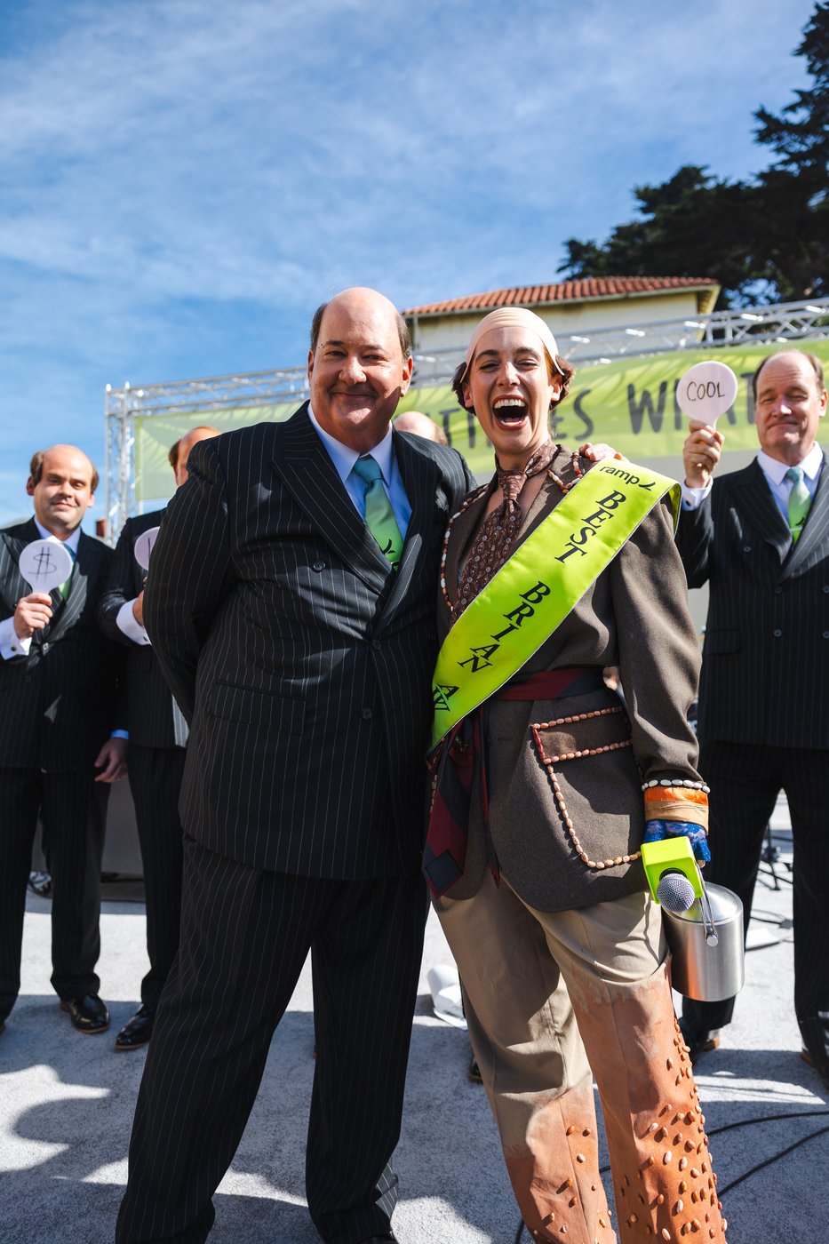 Brian standing with a contest winner wearing a 'BEST BRIAN' sash