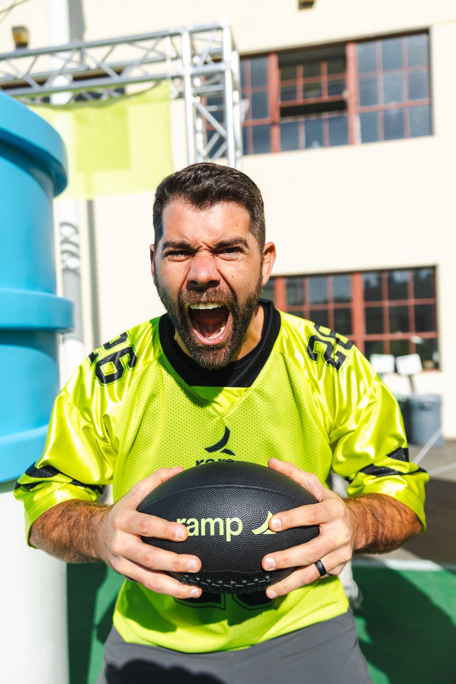 Attendee in Ramp jersey holding a Ramp-branded medicine ball