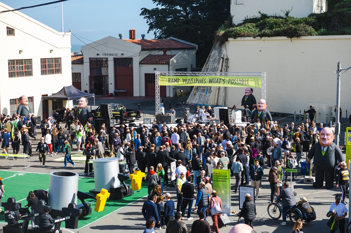 Crowd at the Ramp tailgate under the 'Ramp multiplies what's possible' banner